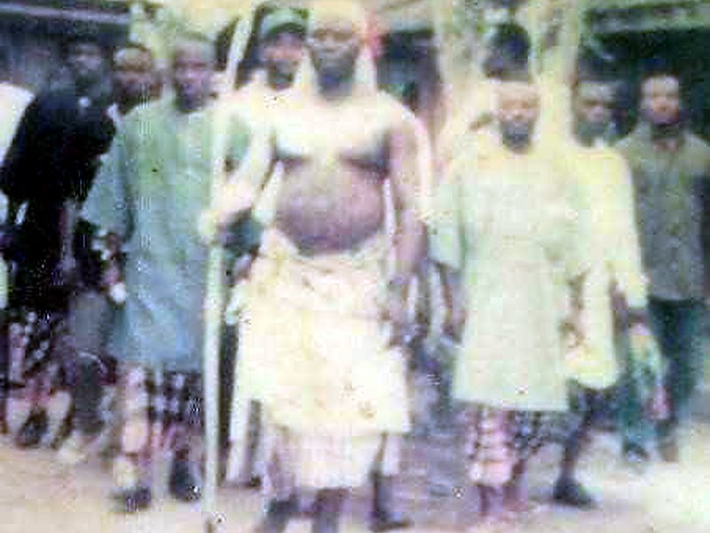 HRM King Bourdillon holding the Oko Inkpara staff of office